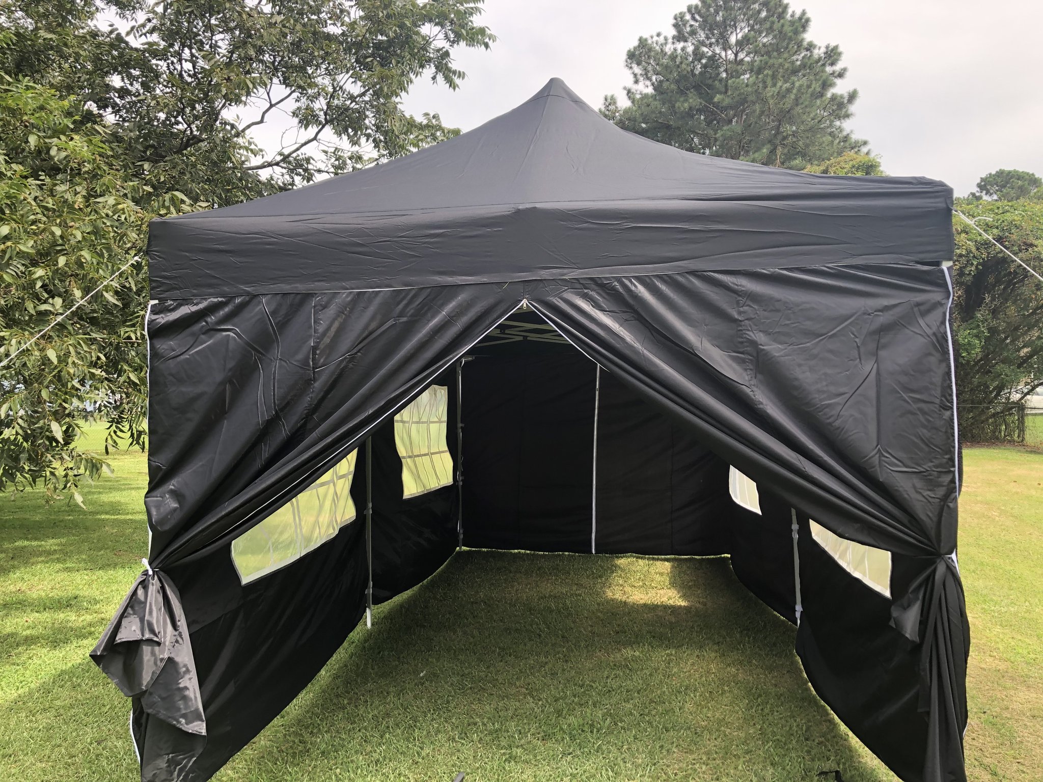 Black pop-up canopy tent with zip-on sidewalls
